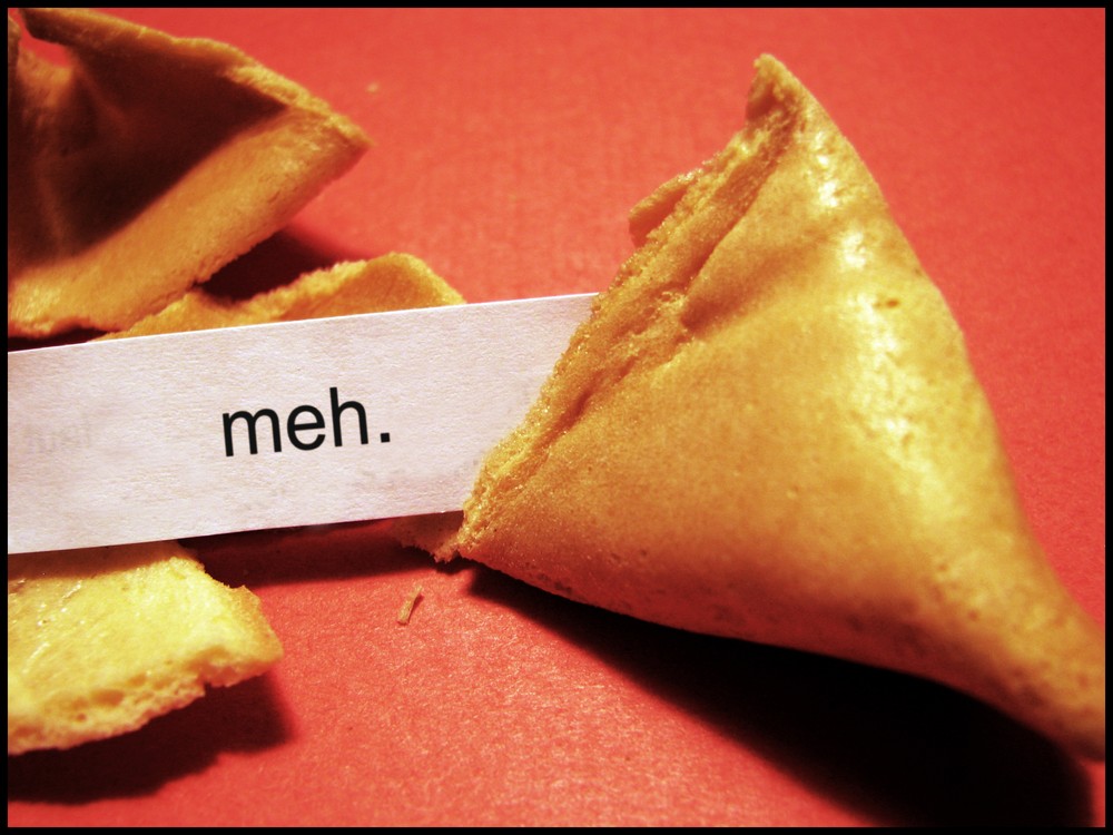 A fortune cookie with the fortune 'meh'